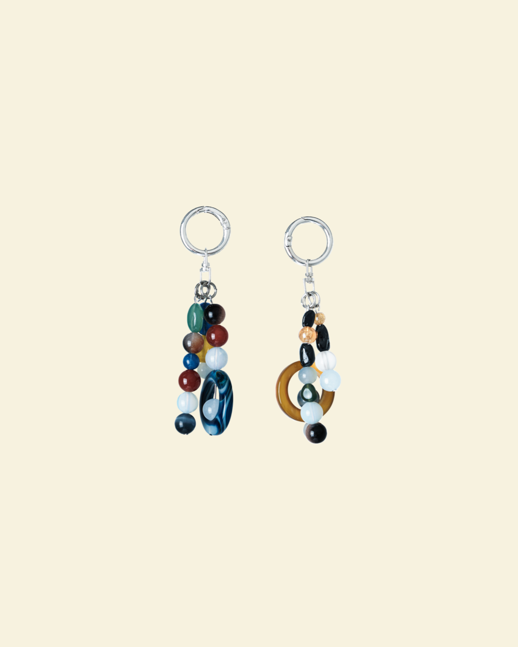 Pair of colorful beaded earrings on a beige background